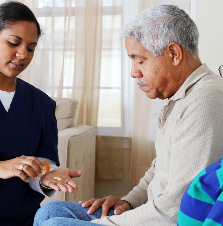 Home health care worker and an elderly couple